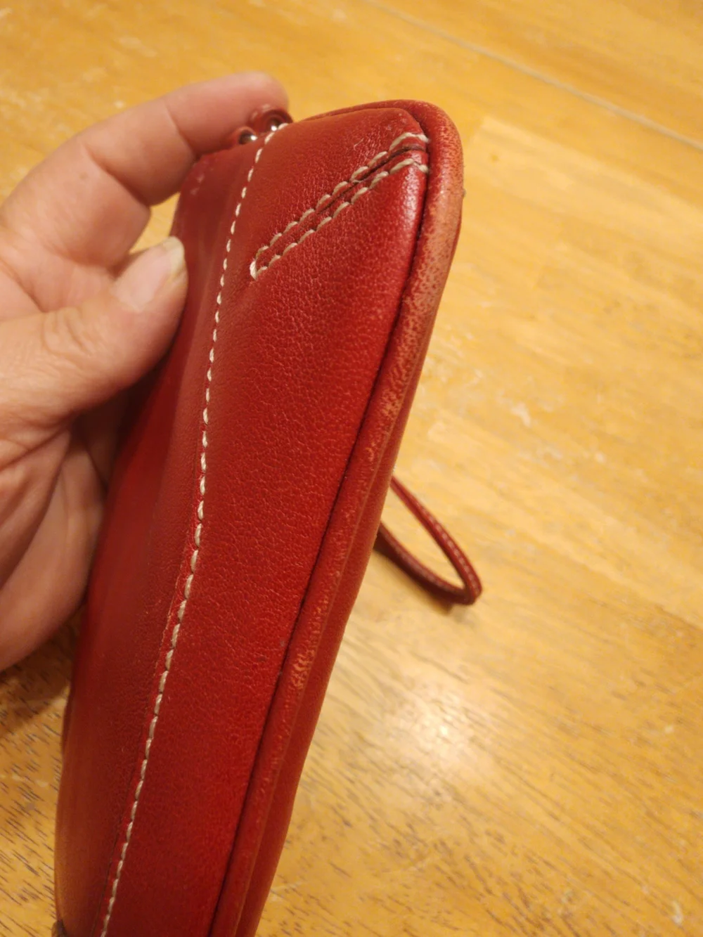 vintage Coach red leather Soho mini wristlet pouch featuring white contrast